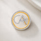 The Classic CA Single Line Double Tick Skeleton Diamond Brooch in 925 Silver with Yellow Finish