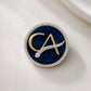 The Laureate CA Diamond Brooch in 925 Silver with Navy Blue Enamel