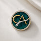 The Laureate CA Diamond Brooch in 925 Silver with Malakite Enamel