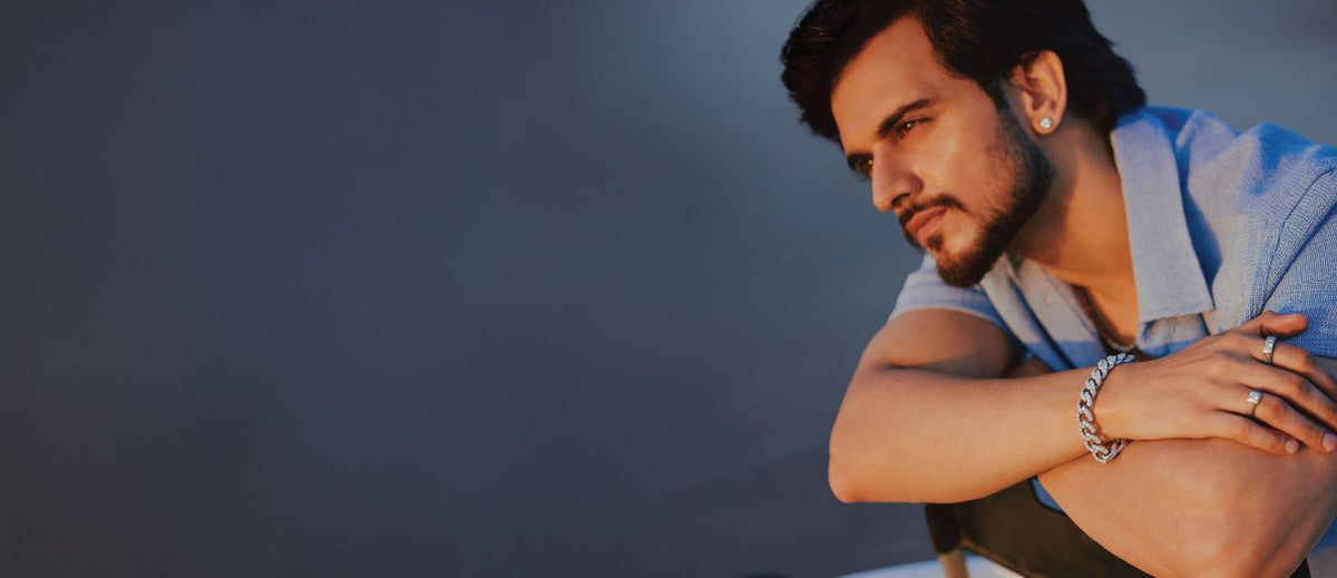 A man wearing men's diamond jewellery
